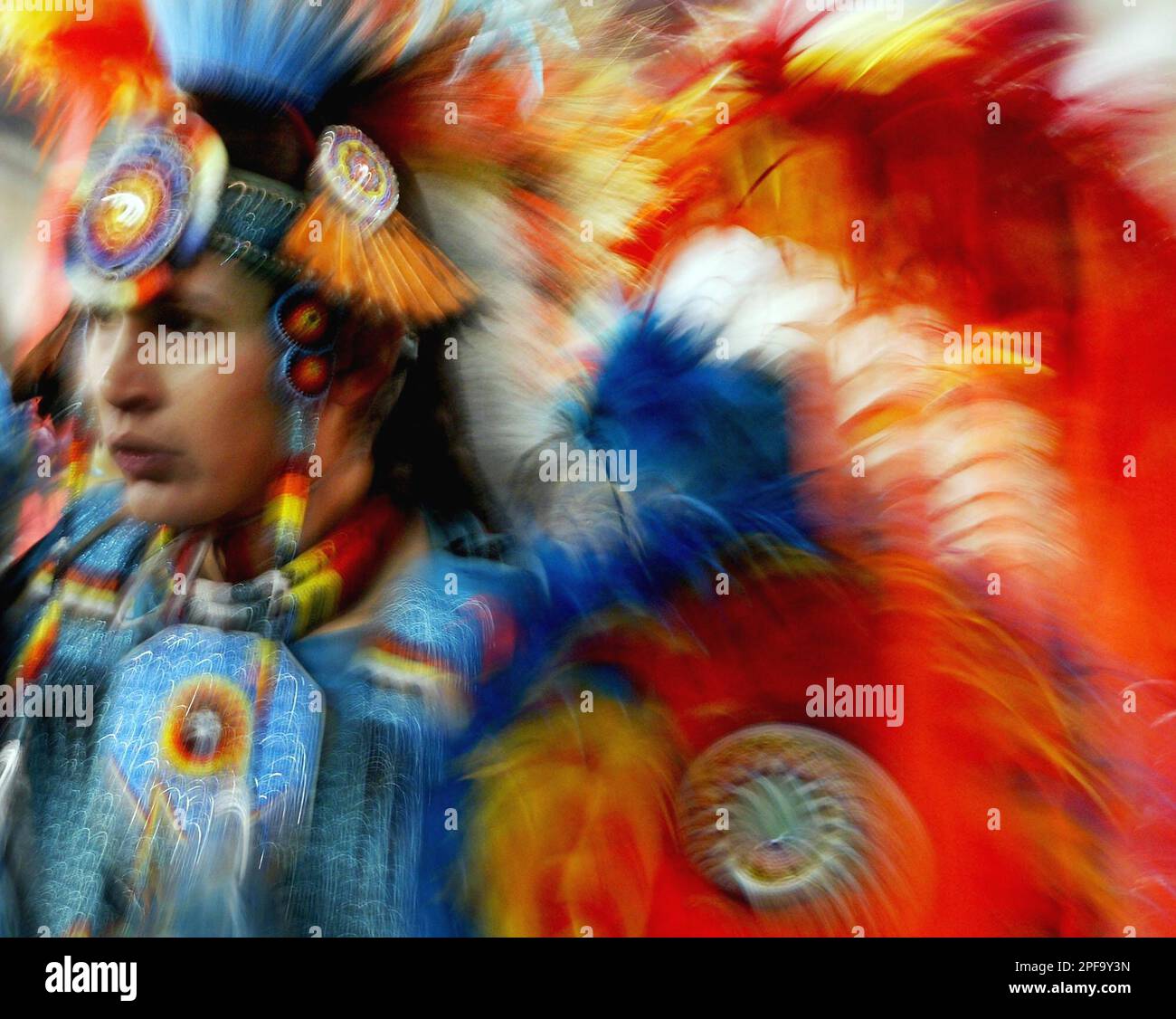 A dancer shows his colors during the grand entry at the Canadian