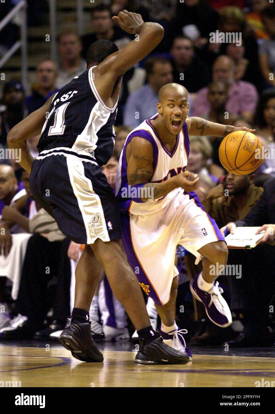 Los Angeles Clippers' Jeff McInnis (5) celebrates his game-winning basket  at the buzzer as Phoenix Suns' Stephon Marbury, right, watches Friday,  March 29, 2002, in Phoenix. The Clippers won 96-94. (AP Photo/Matt