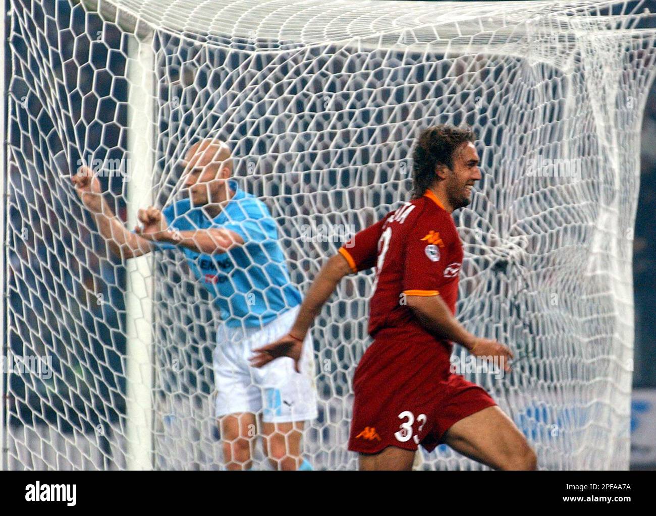AS Roma's Gabriel Omar Batistuta, of Argentina, right, celebrates after  scoring to Lazio during the Serie A Italian top League soccer match Rome's  Olympic stadium, Sunday, Oct. 27, 2002. At left Lazio's, image size:1300x1023