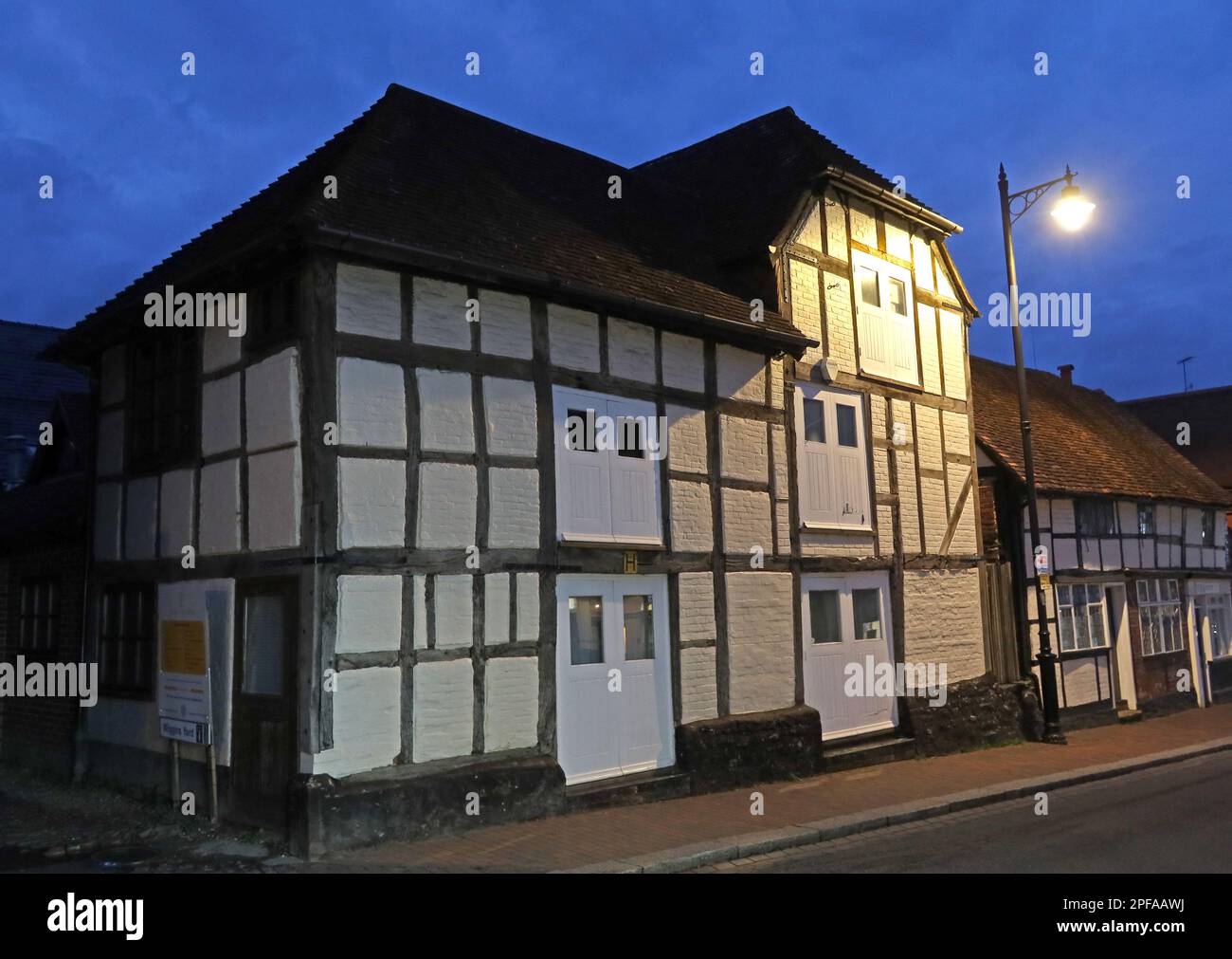 Former 17th century Brewery grain store, grade II Listed historic building at dusk, 39-40, Bridge St, Godalming, Surrey, England, UK, GU7 1HP Stock Photo