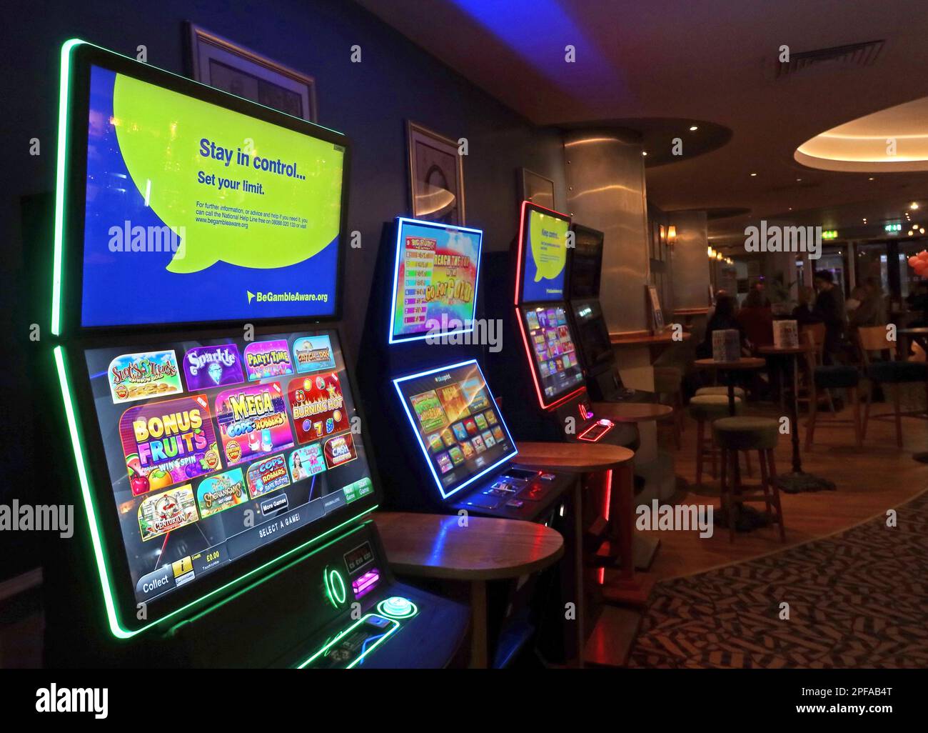 Fruit machines in a Wetherspoons, dangers of under 18s and gamblers with issues accessing gaming machines in UK pubs & bars Stock Photo