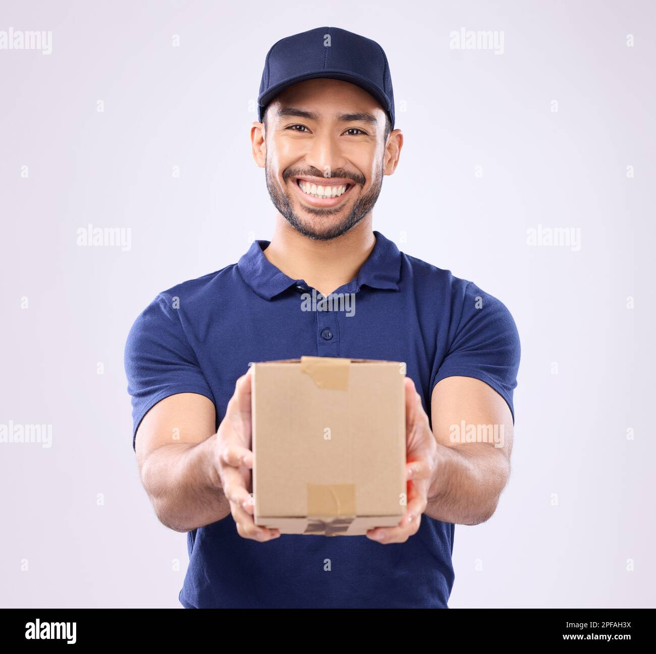 Delivery, box and portrait of asian man in studio for shipping, courier