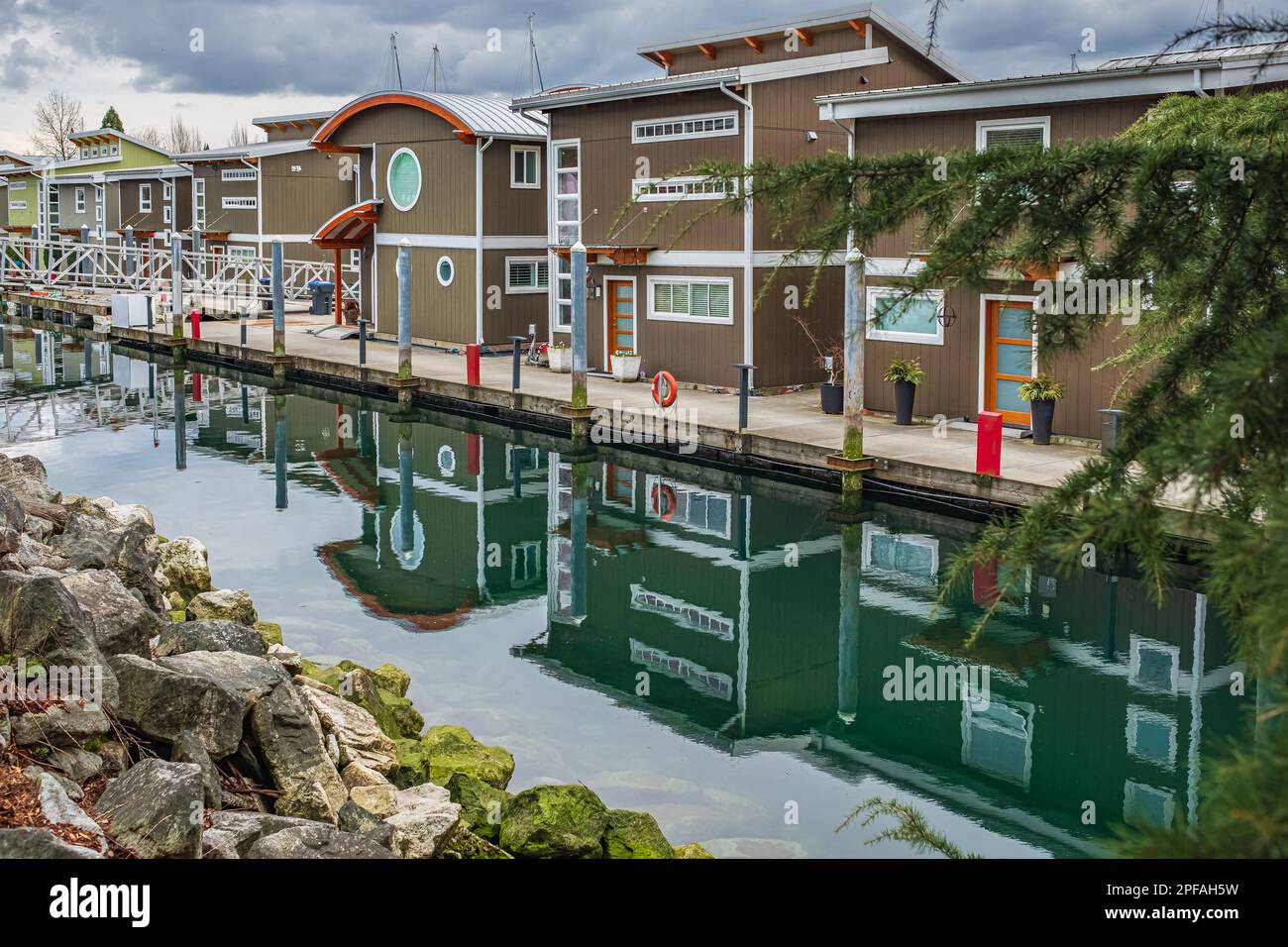 Houseboats and floating homes at sunny day. Modern Floating houses at