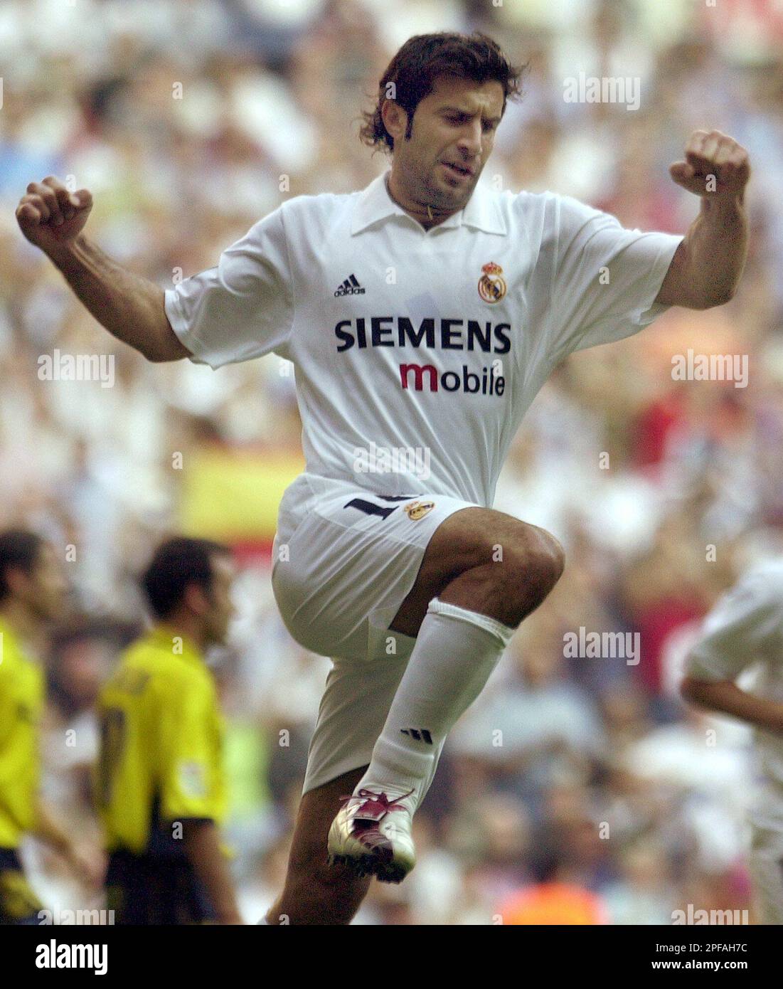 Real Madrid's Portuguese player Luis Figo celebrates after scoring