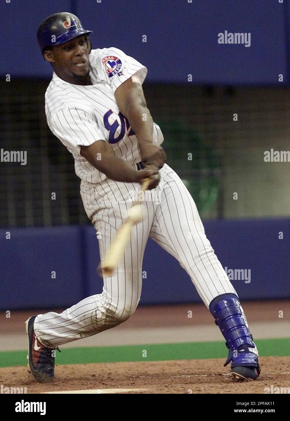 Montreal Expos' Vladimir Guerrero hits a two-run home run off St. Louis  Cardinals pitcher Larry Luebbers to extend his hitting streak to 30 games  in Montreal Wednesday, August 25, 1999. (AP PHOTO/Ryan