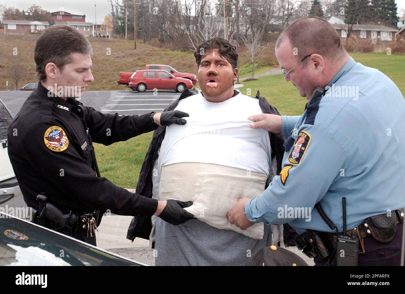 ** FILE ** Lower Burrell Police officer John Marhefka, left, and Arnold