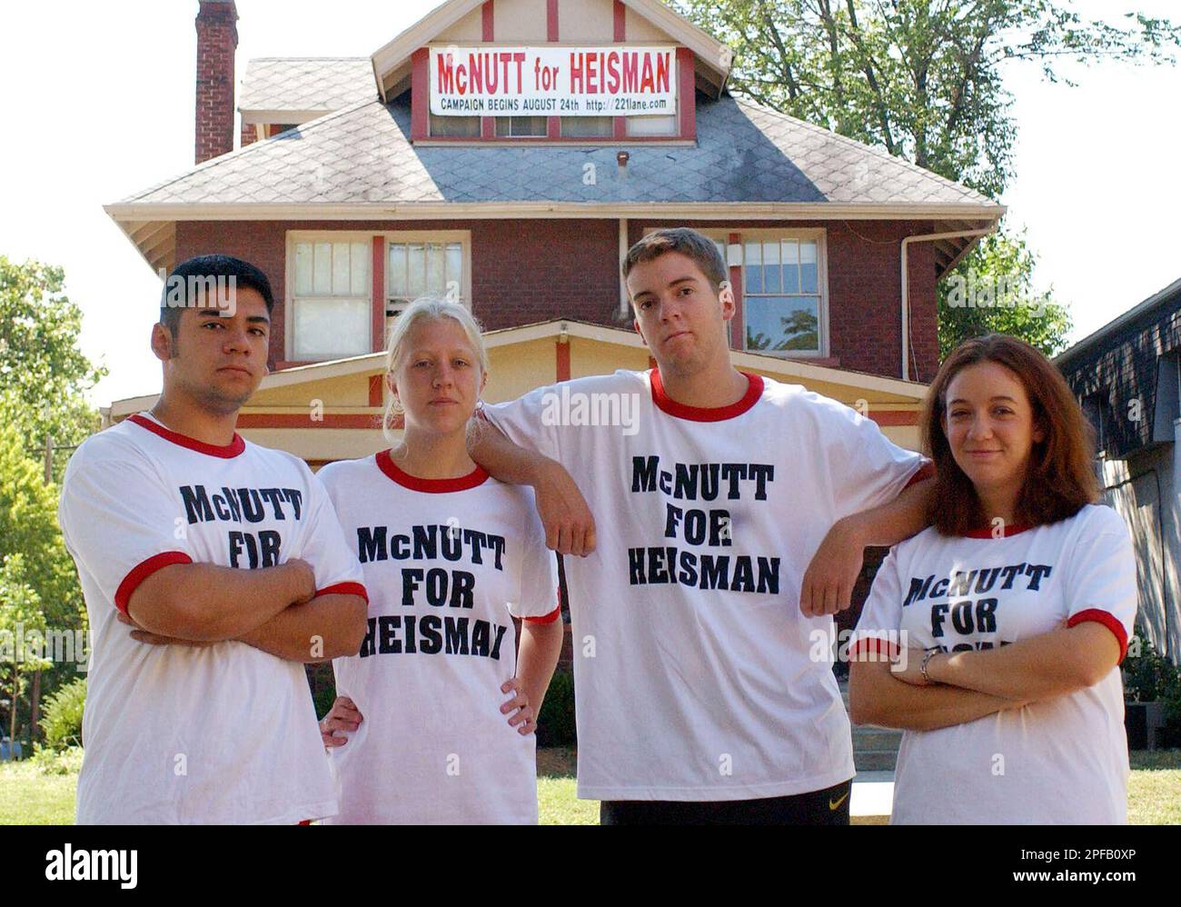 ohio-state-students-matt-dillon-left-ashley-roll-steve-jahn-and-brandy-fawcett-pose-in-front-of-their-house-off-campus-wearing-their-mcnutt-for-heisman-t-shirts-wednesday-sept-4-2002-in-columbus-ohio-the-students-made-the-shirts-as-a-gag-to-promote-ohio-state-defensive-back-richard-mcnutt-for-the-heisman-trophy-ap-phototerry-gilliam-2PFB0XP.jpg