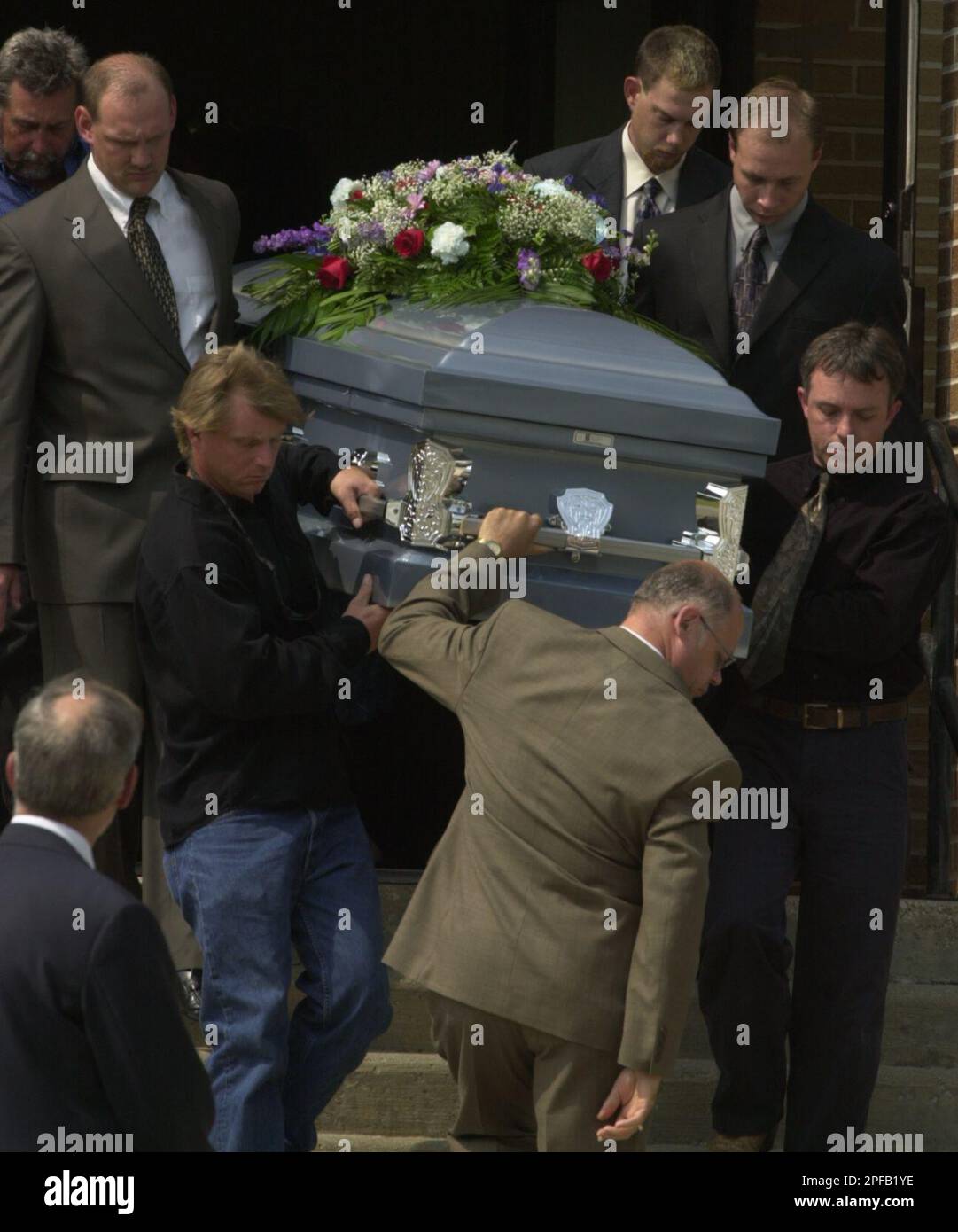 Pallbearers take 11yearold Raymond Levi Boothe's casket down the