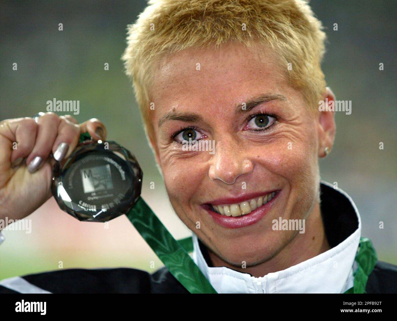 German Grit Breuer displays the silver medal she won in the 400 m final