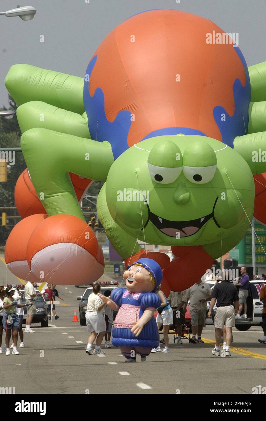 Medical Mutual of Ohio's spider balloon looks down at Miss Muffet