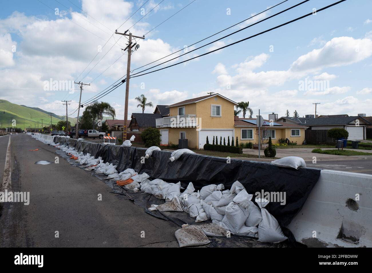 Sandbags line the street, as residents recover from major flooding