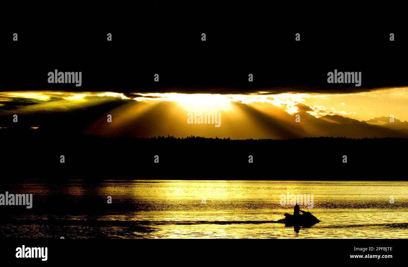A jetski rider skims over the water of Dyes Inlet in Tracyton, Wash