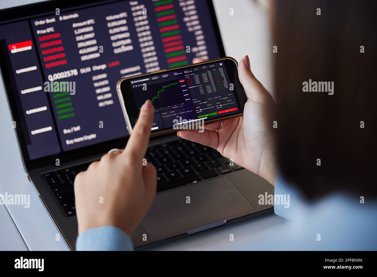 Stock trading chart, laptop and phone in hands of woman for crypto, data  analysis and bitcoin screen. Fintech growth, ecommerce and girl on  technology Stock Photo - Alamy