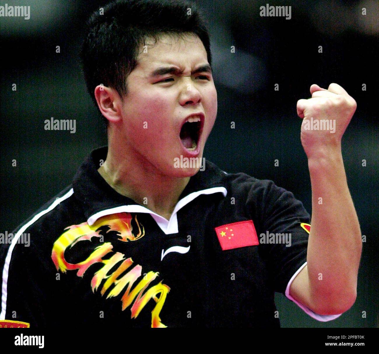 Chinese Liu Guozheng clenches his fist in jubilation during his match ...
