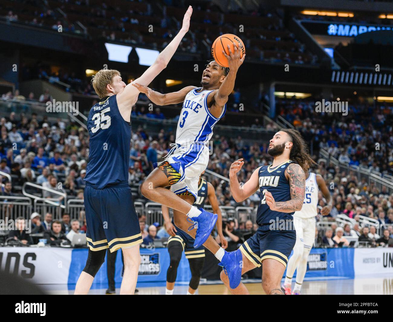 March 16, 2023: Oral Roberts Golden Eagles forward Connor Vanover (35) and Oral Roberts Golden Eagles guard Kareem Thompson (2) attempt to defend a drive to the basket by Duke Blue Devils guard Jeremy Roach (3) during 2nd half NCAA Orlando Regional between Oral Roberts Golden Eagles and Duke Blue Devils. Duke defeated Oral Robert 74-51 at Amway Center in Orlando, FL. Romeo T Guzman/CSM. Stock Photo