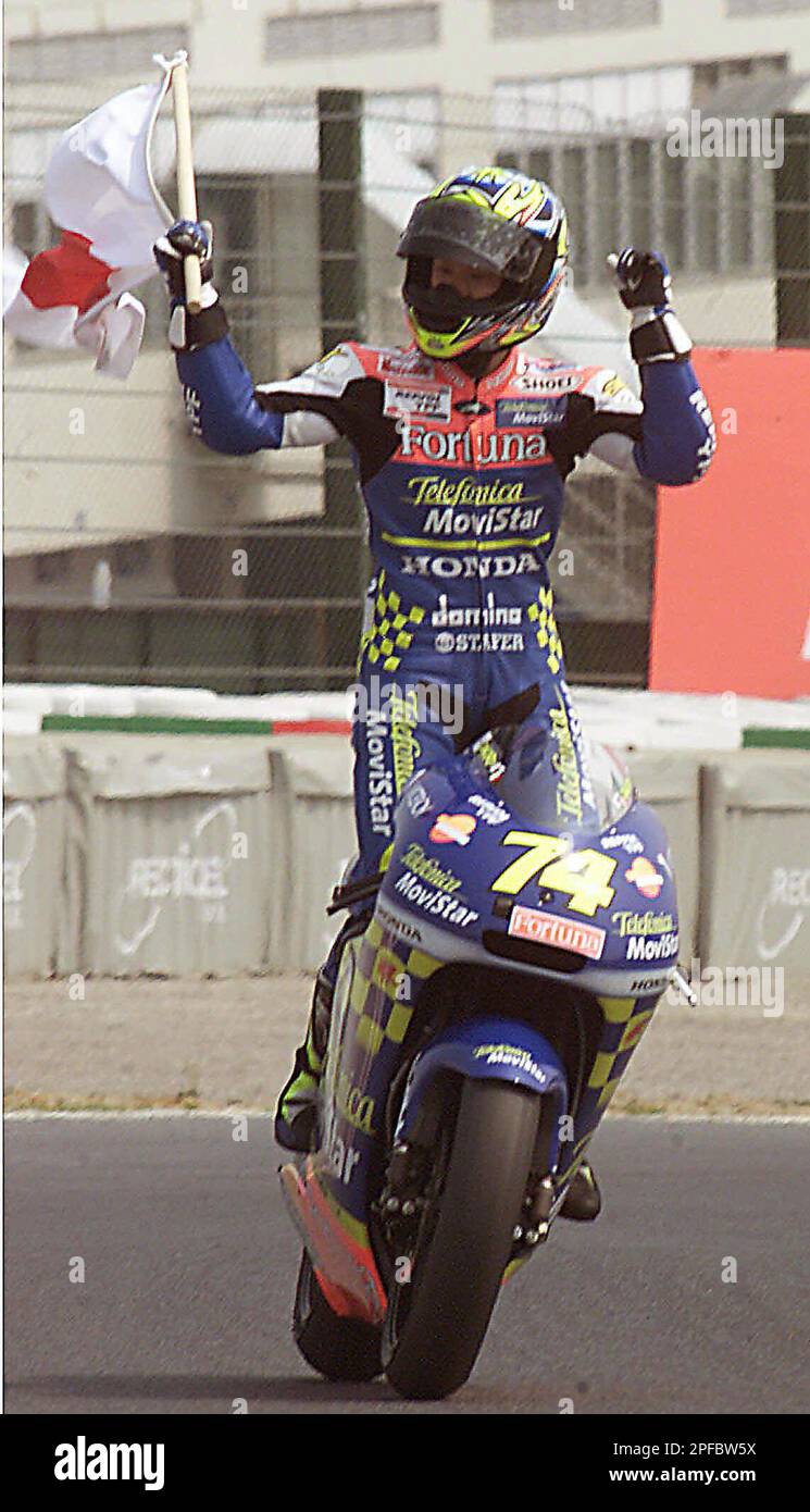 250cc class winner Daijiro Kato of Japan riding on a Movistar