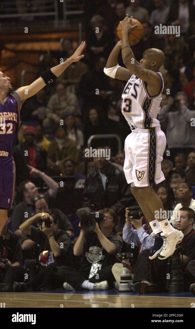 New Jersey Nets' and Eastern Conference All Star Stephon Marbury, right,  makes what was to be the winning shot against Phoenix Suns and Western  Conference All Star Jason Kidd, left, as the