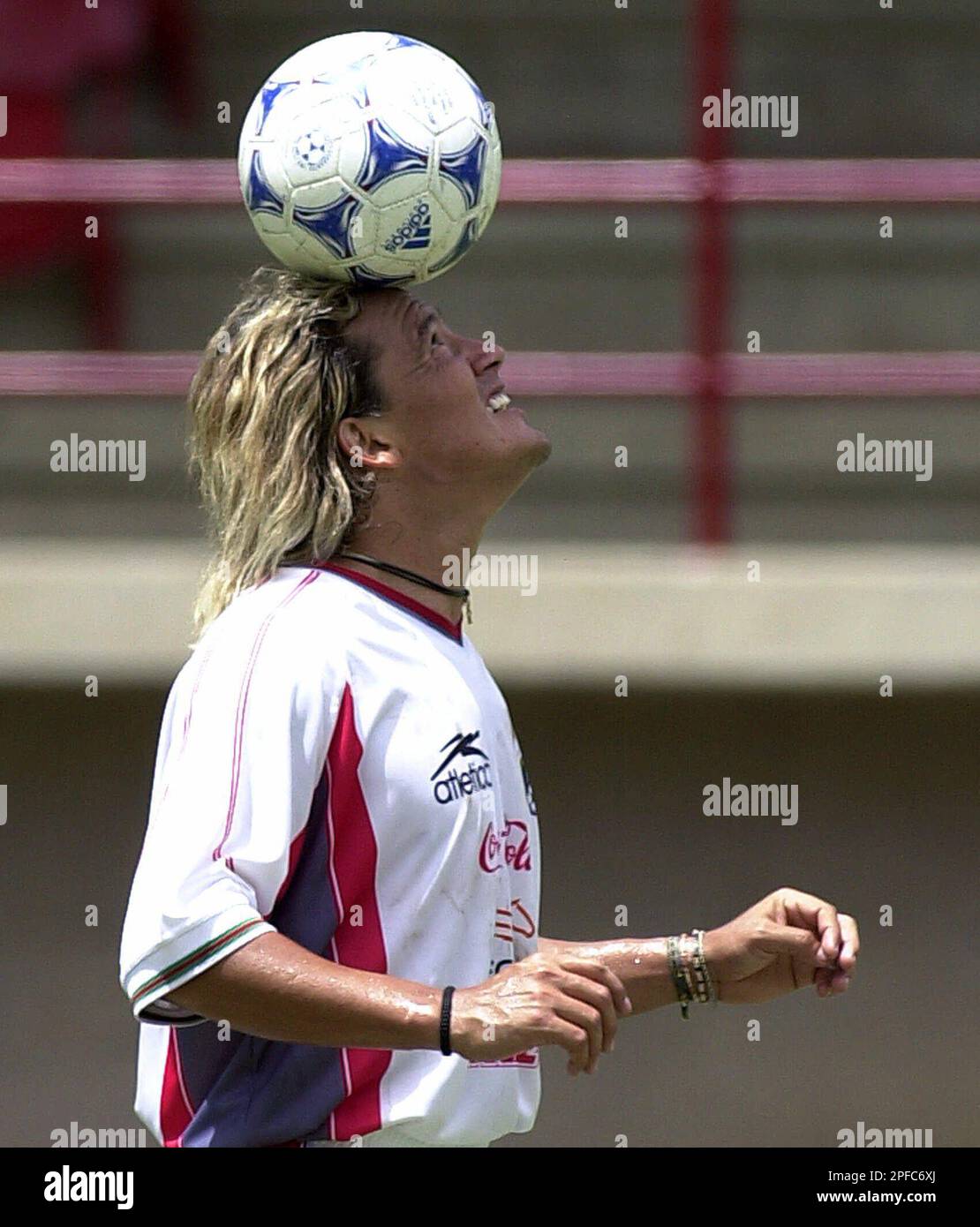 Mexican soccer star Luis Hernandez heads a ball during a training