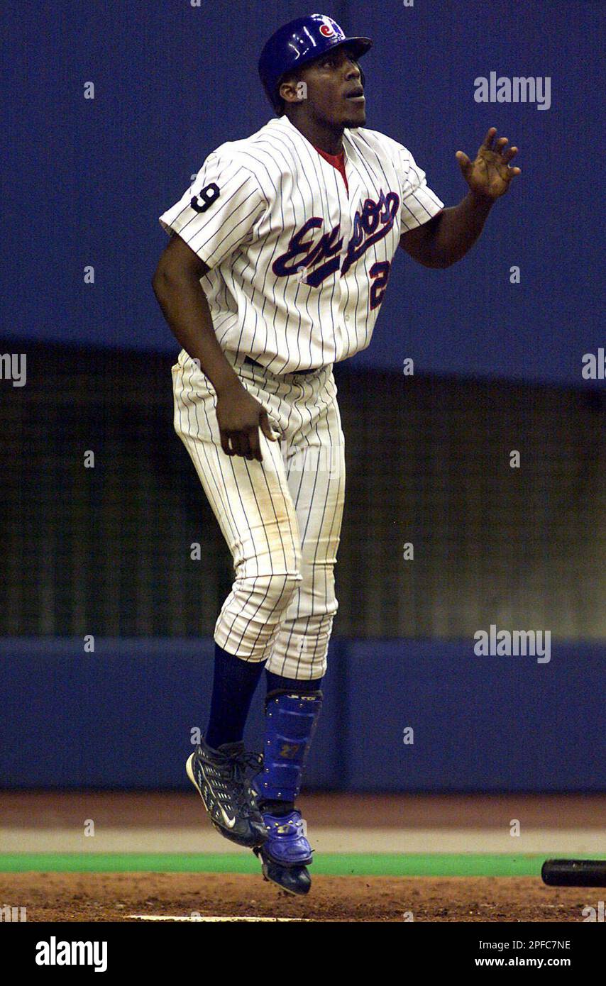 Montreal Expos Vladimir Guerrero watches the ball leave the park