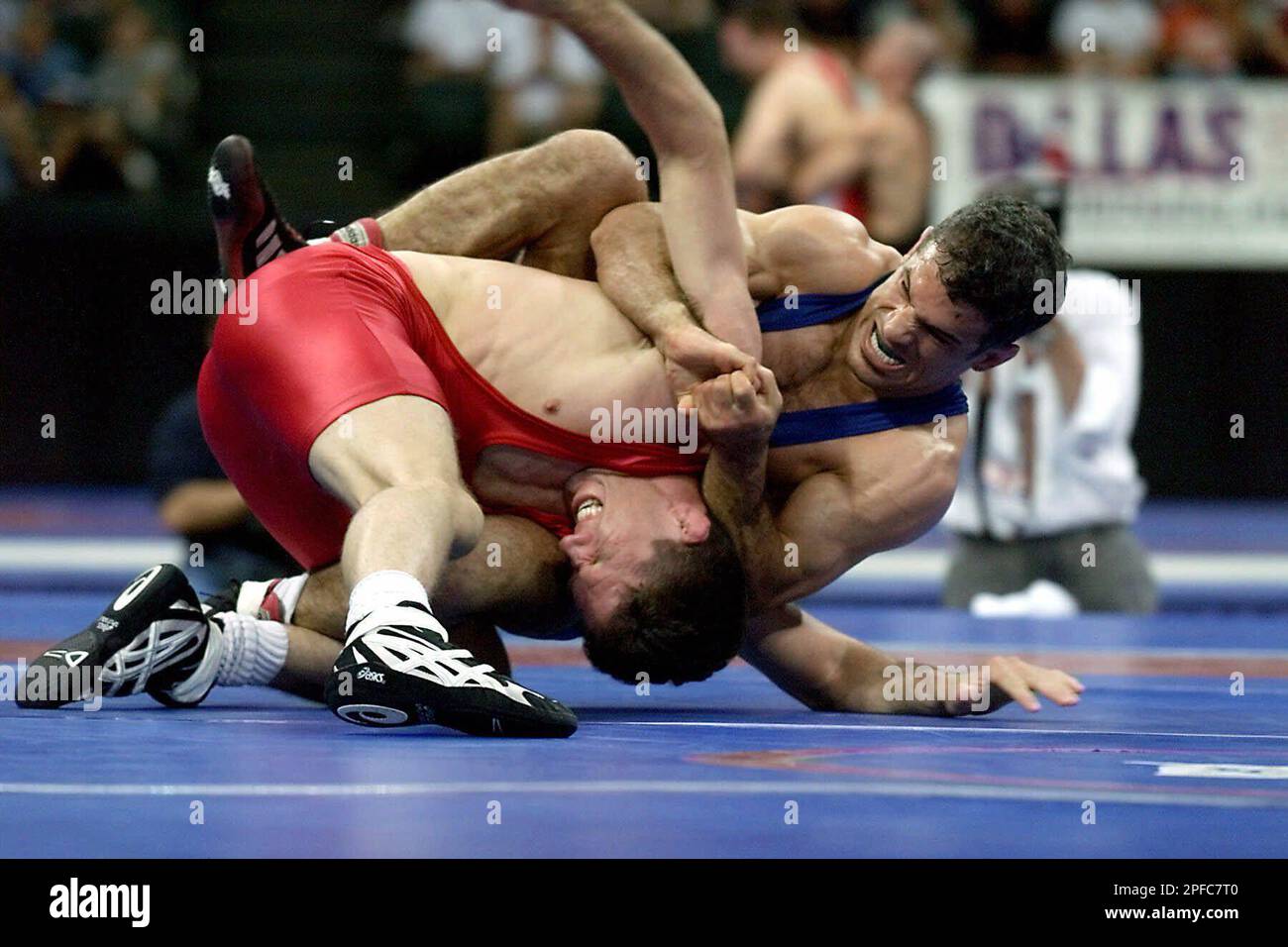 John Guira, right, from New York, tries to roll over Terry Steiner, from Madison, Wis., during their 69kg bout in freestyle wrestling during the U.S