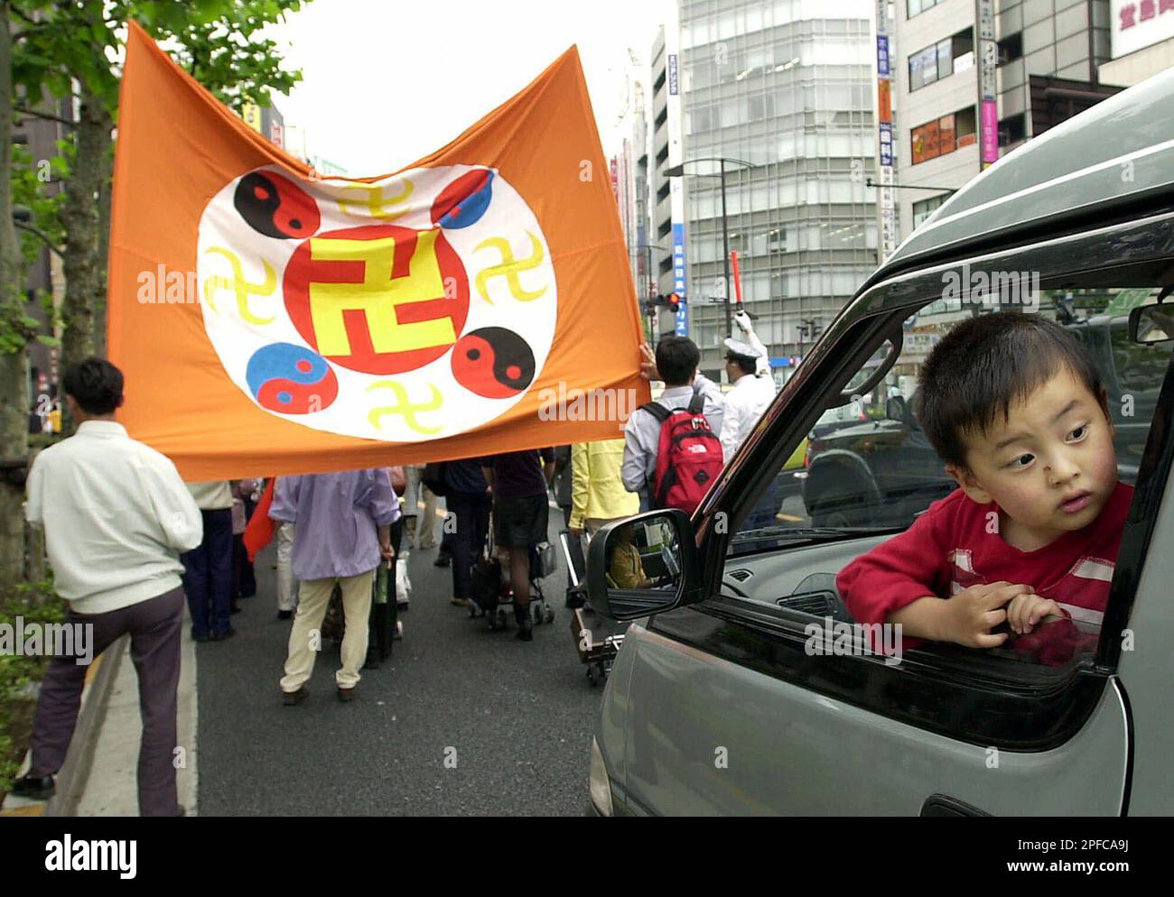 Kenji Kobayashi, 3, a son of a Japanese Falun Gong follower, looks out