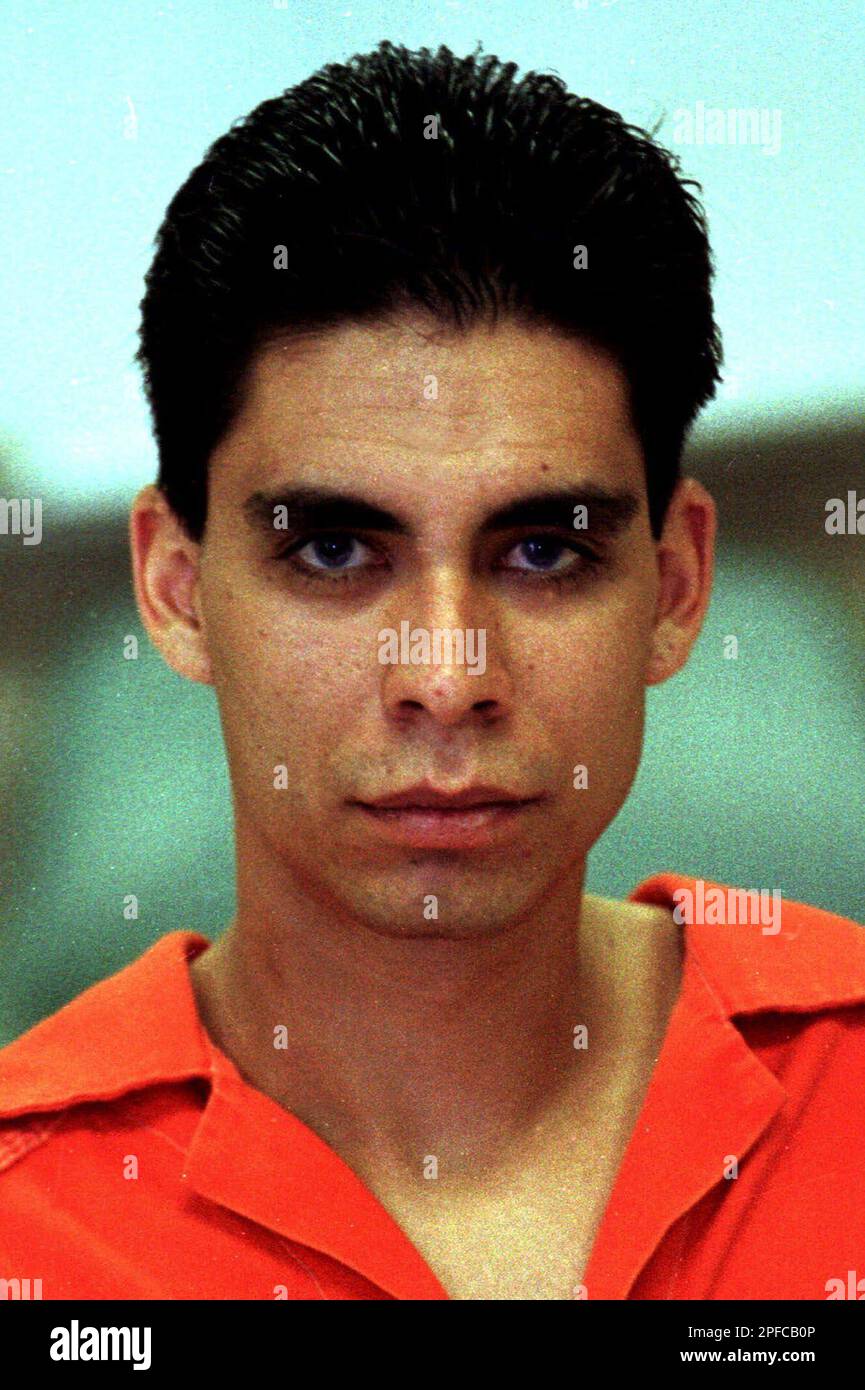 FILEJesse Avalos Jr. looks at the camera as he is led back to his