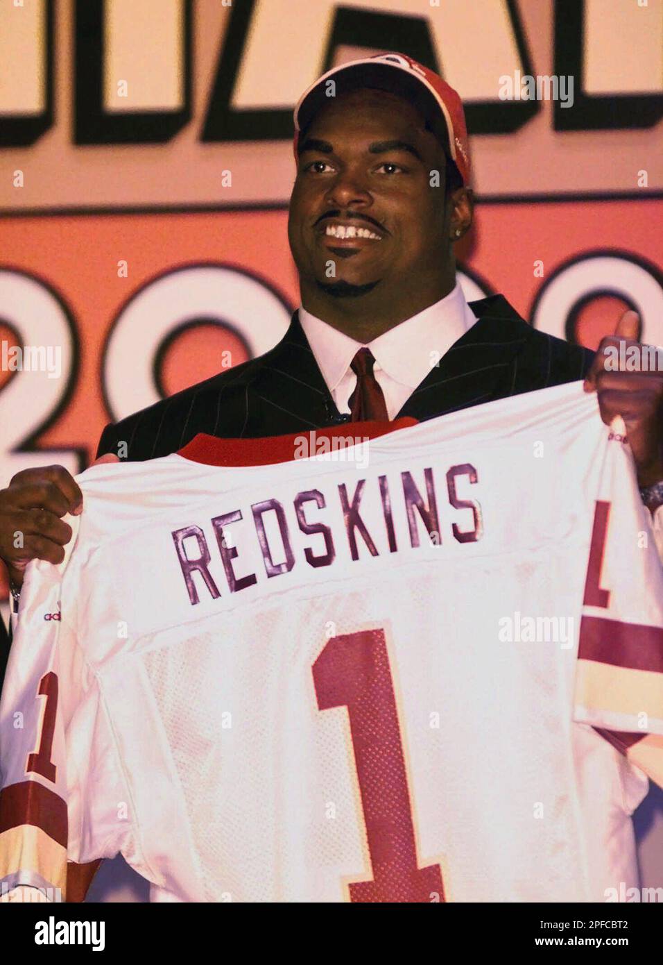 linebacker LaVar Arrington, of Penn State, holds up a Washington Redskins  jersey after the Redskins selected him as the team's No. 1 pick, second  overall, in the NFL draft Saturday, April 15,