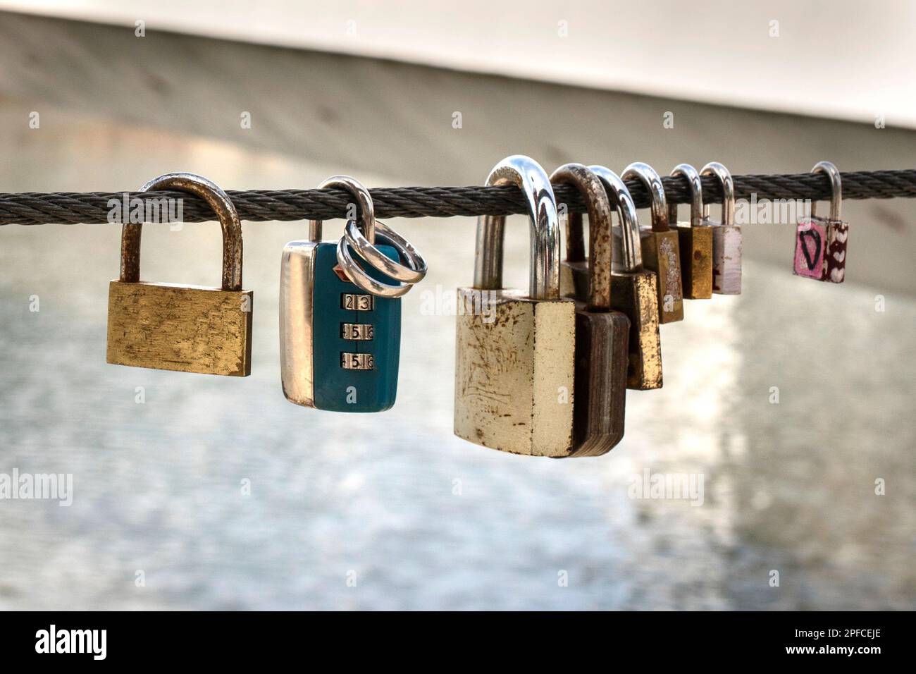 Love locks tied on a bridge as a symbol of eternal love Stock Photo - Alamy