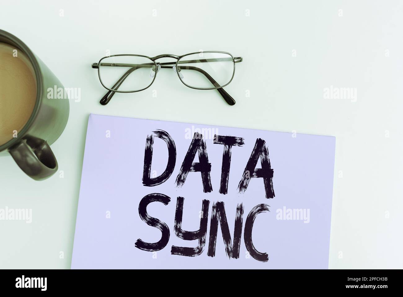 Handwriting text Data Sync. Concept meaning data that is continuously generated by different sources Stock Photo