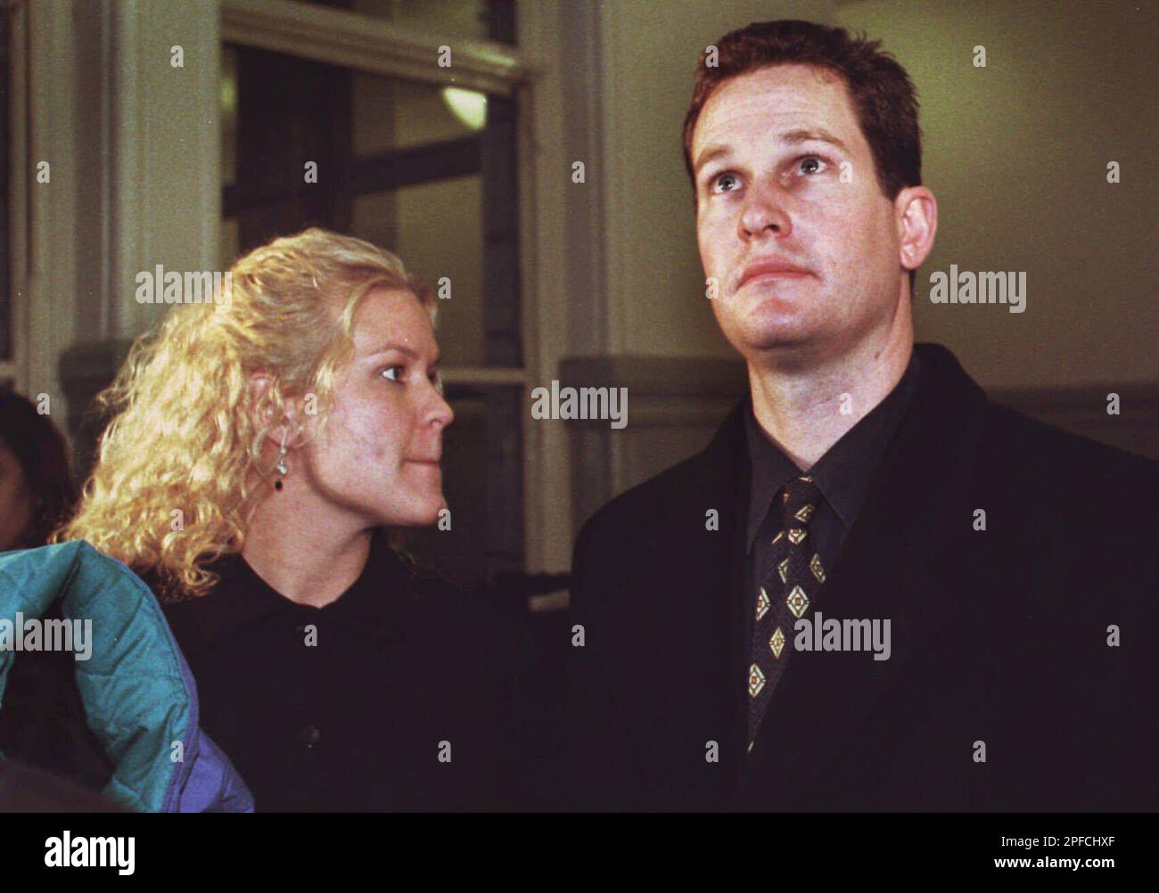 Jeremy Witherell, right, leaves the courtroom with his wife Lynn