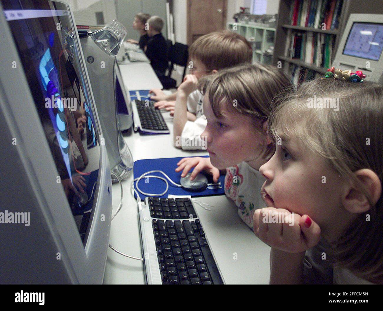 Second graders Lindsey Shumat, left, and Heather Wesselman, right