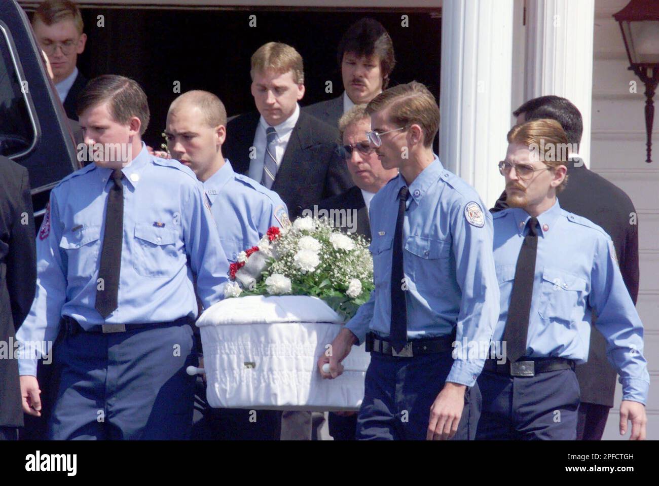 Pallbearers, including Chad Fields, second from right, brother of Lisa