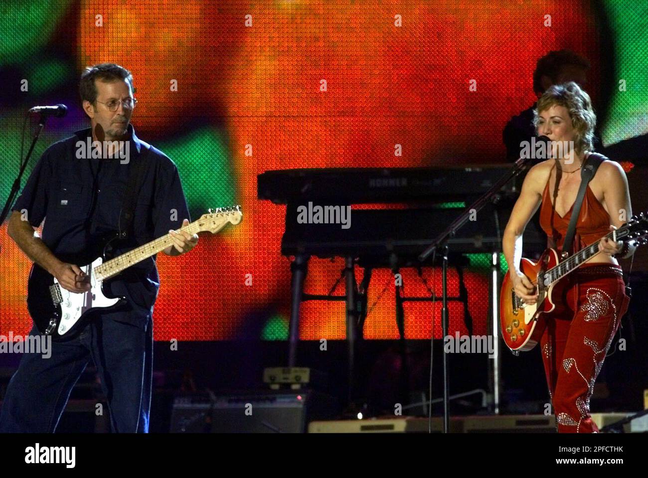 Singers Eric Clapton and Sheryl Crow perform during the 