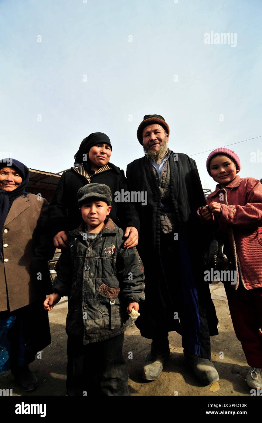 An Uyghur family visiting a local market in the outskirts of Kashgar