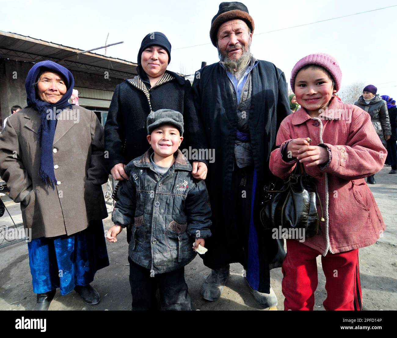 An Uyghur family visiting a local market in the outskirts of Kashgar