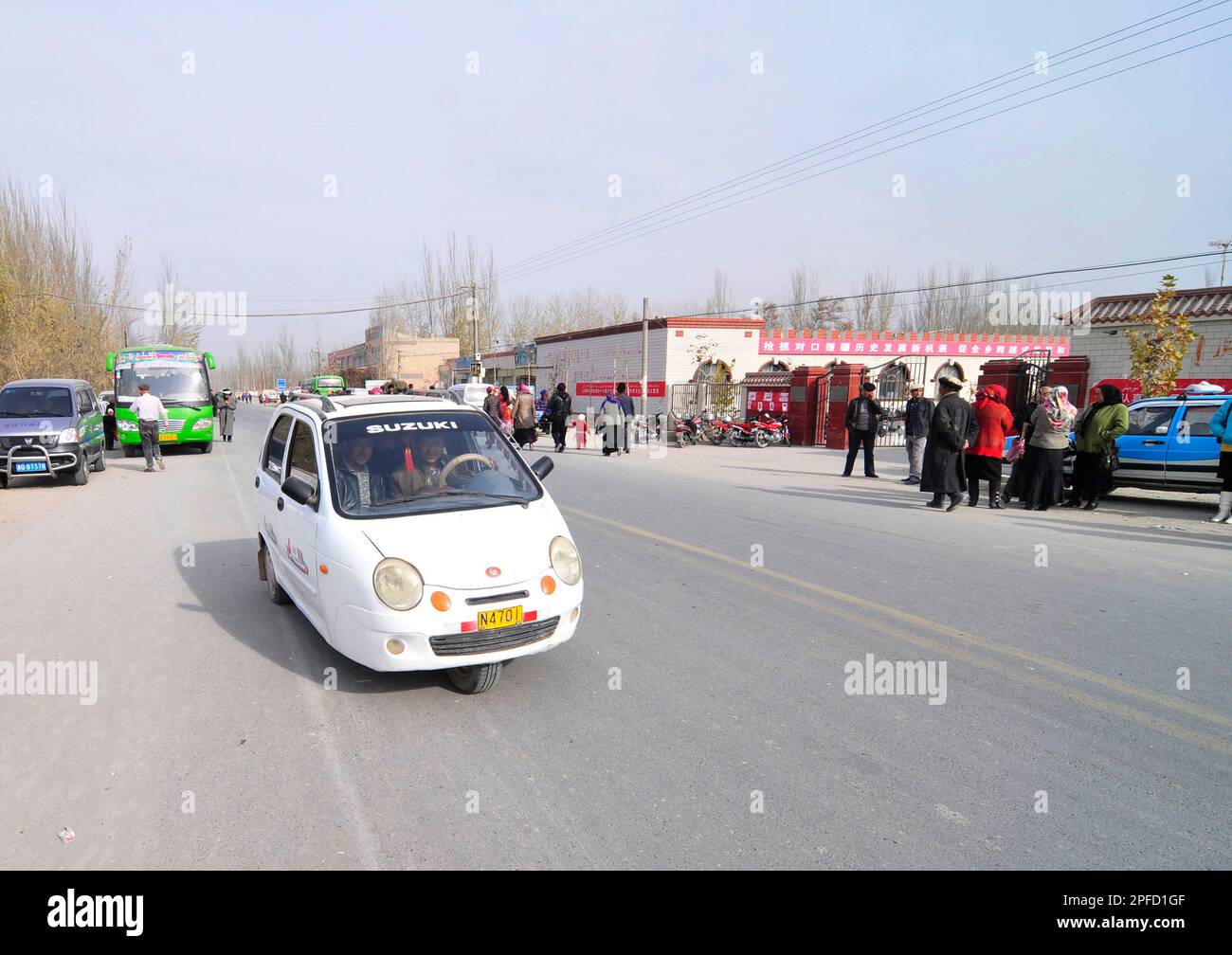 A Chinese Three Wheel Motorcycle for passengers is a common vehicle in rural China. Photo taken in Xinjiang, China. Stock Photo