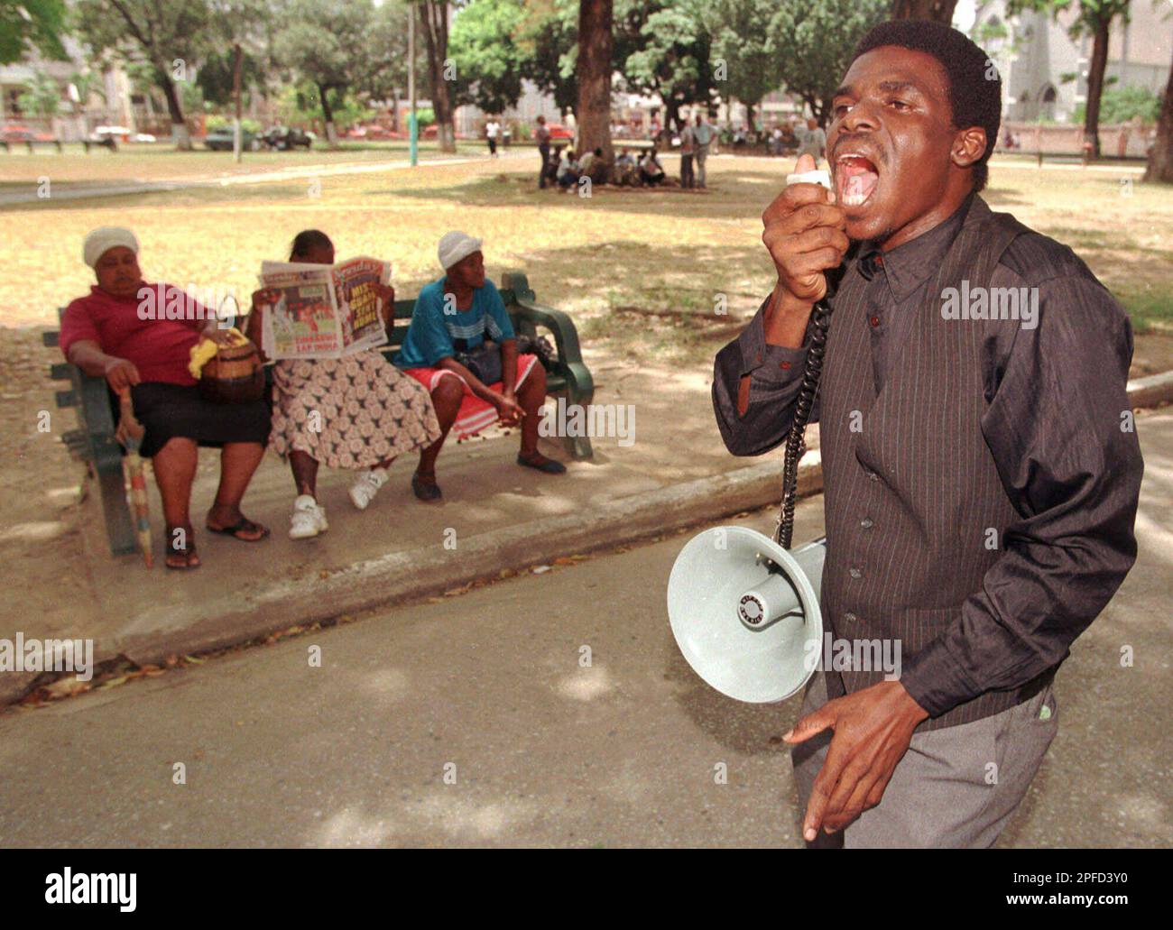 Johnny Musgrave Talks Through A Bulllhorn As He Preaches To Lunchtime johnny-musgrave-talks-through-a-bulllhorn-as-he-preaches-to-lunchtime