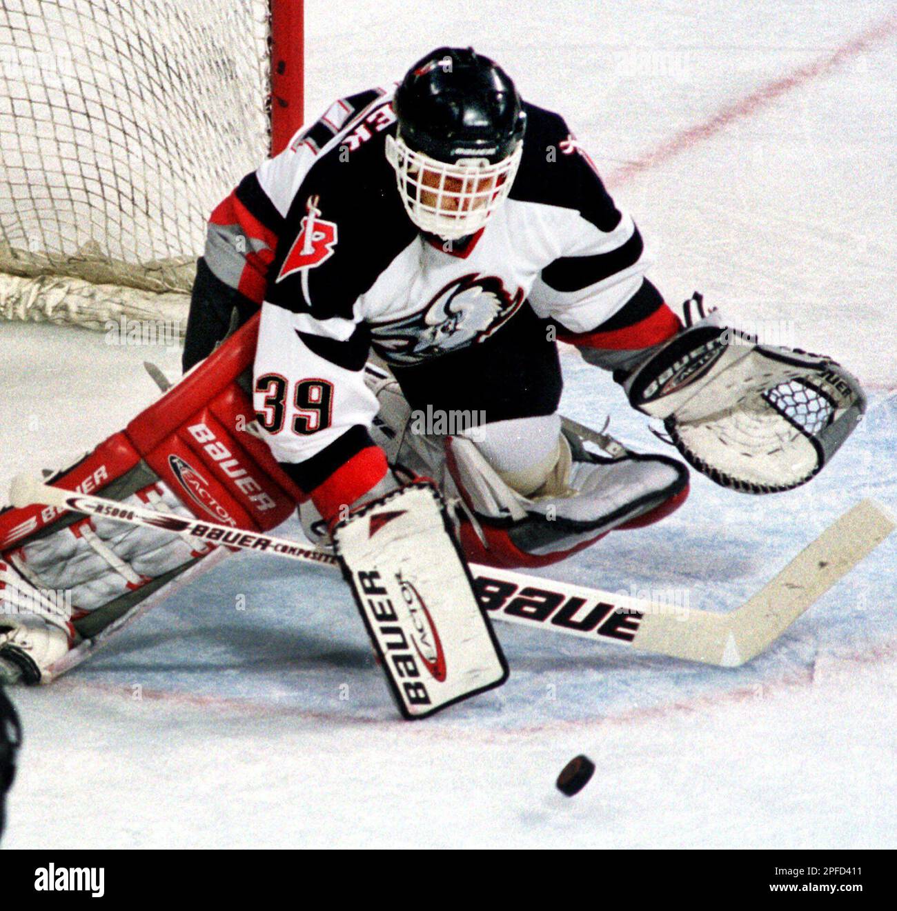 Buffalo Sabres goaltender Dominik Hasek deflects a shot on goal by