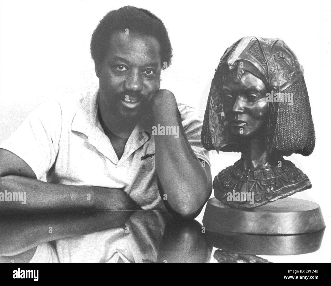 Artist Eddie Dixon is shown in this March 26, 1985 photo with one of