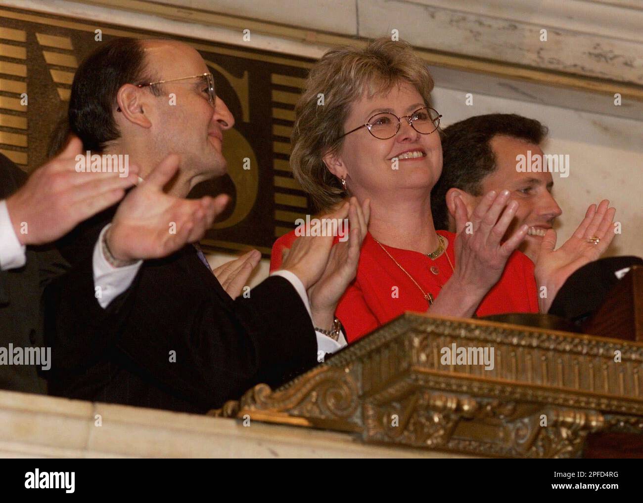 Katherine Hudson, president and CEO of Brady Corp., is joined in applause by New York Stock Excahnge Chairman Richard Grasso, left, after she rang the opening bell during listing ceremonies, Tuesday, May 18, 1999. The company, based in Milwaukee, Wis., manufactures identification systems, tapes and components for adhesion. They do business in 18 countries and operate 16 manufacturing facilities worldwide. (AP Photo/Richard Drew) Stock Photo