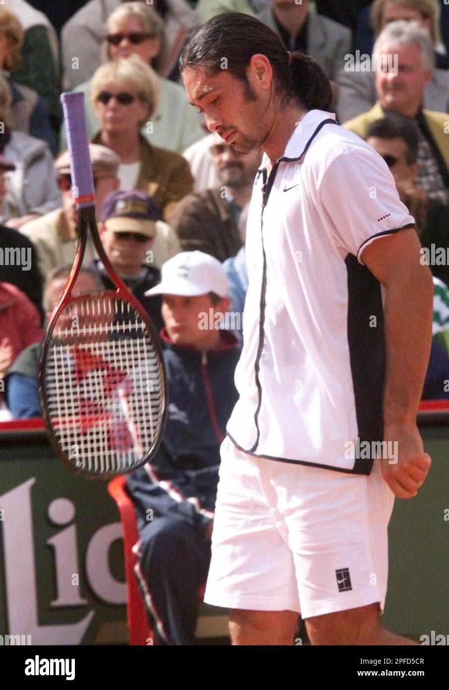 Tennis player Marcelo Rios from Chile throws his racket during his match  against German Oliver Gross in the second round of the German Open tennis  tournament in Hamburg, Germany, Wednesday, May 5,