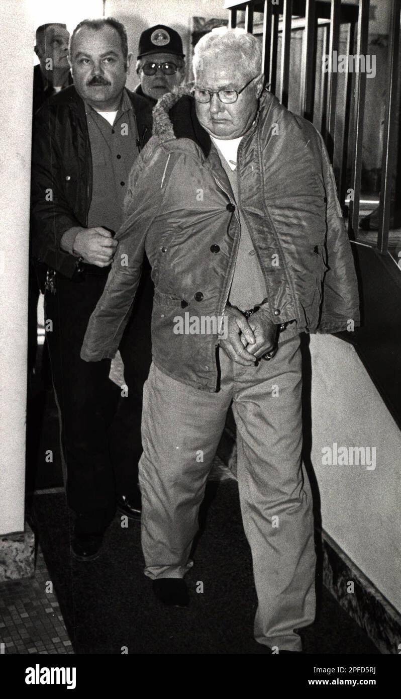 FILERalph Orin Davis is led into the Henry County Courthouse in Mt
