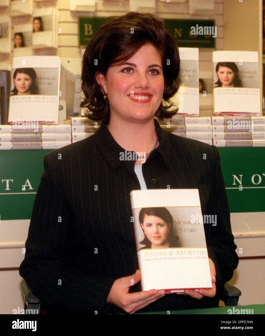 Former White house intern Monica Lewinsky displays a copy of her book ...