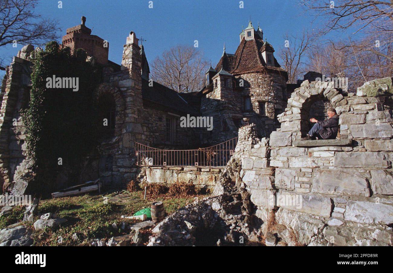 Peter Wing sits in a opening in the entrance of Wing's Castle on Monday