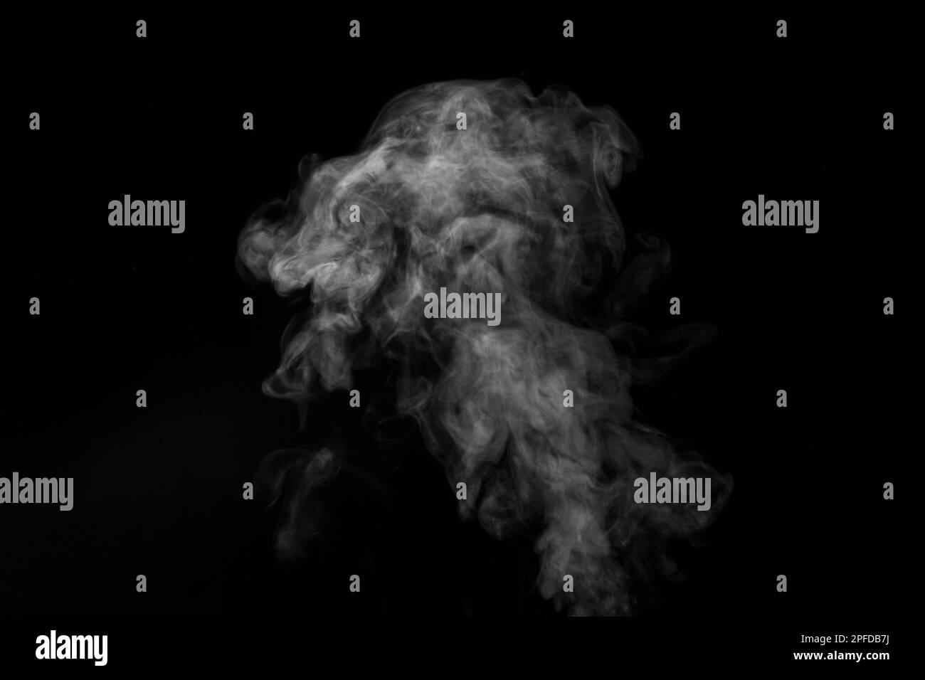 Curly white steam rising up and splashing water scattering in different directions isolated on a black background. Can be used as background, design e Stock Photo