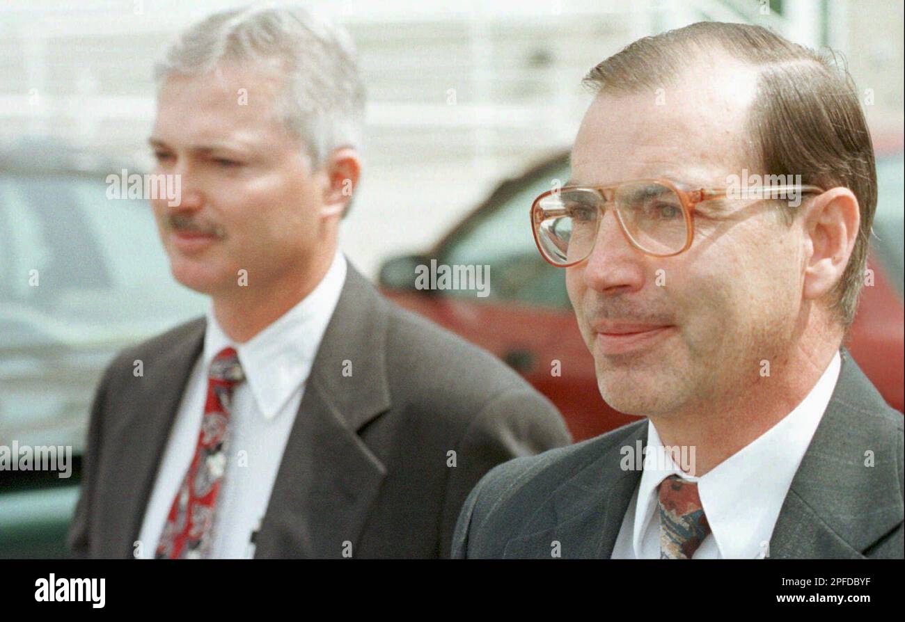 John Daniel Kingston, left, walks with his attorney Carl Kingston
