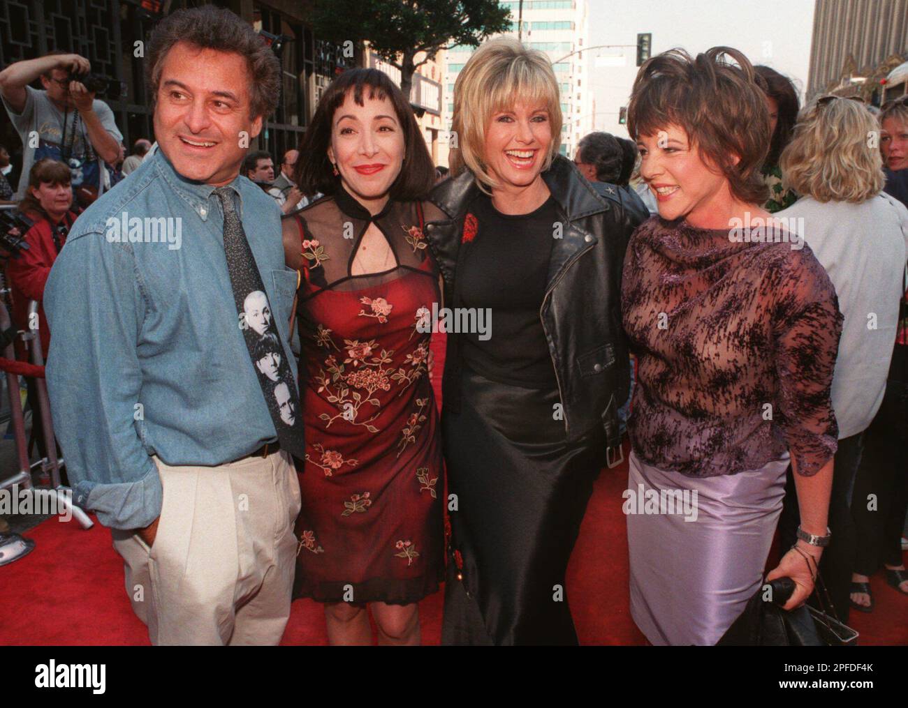 Original "Grease" movie cast members, from left, Barry Pearl ("Doody"), Didi Conn ("Frenchy"), Olivia Newton-John ("Sandy"), and Stockard Channing ("Rizzo"), pose during the 20th anniversary re-release premiere of "Grease" outside Mann's Chinese Theatre in Los Angeles Sunday, March 15, 1998. (AP Photo/E.J. Flynn) Stock Photo