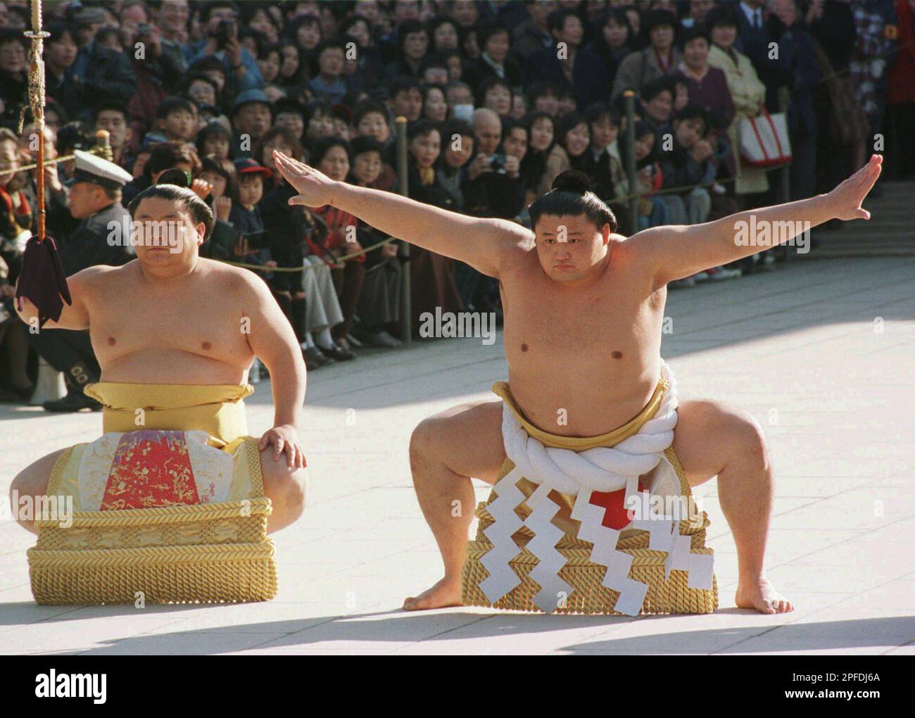 Sumo grand champion Takanohana, by sword bearer Takatoriki