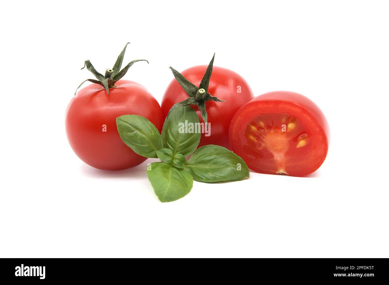 Cherry tomatoes with basil leaves isolated on white background Stock ...