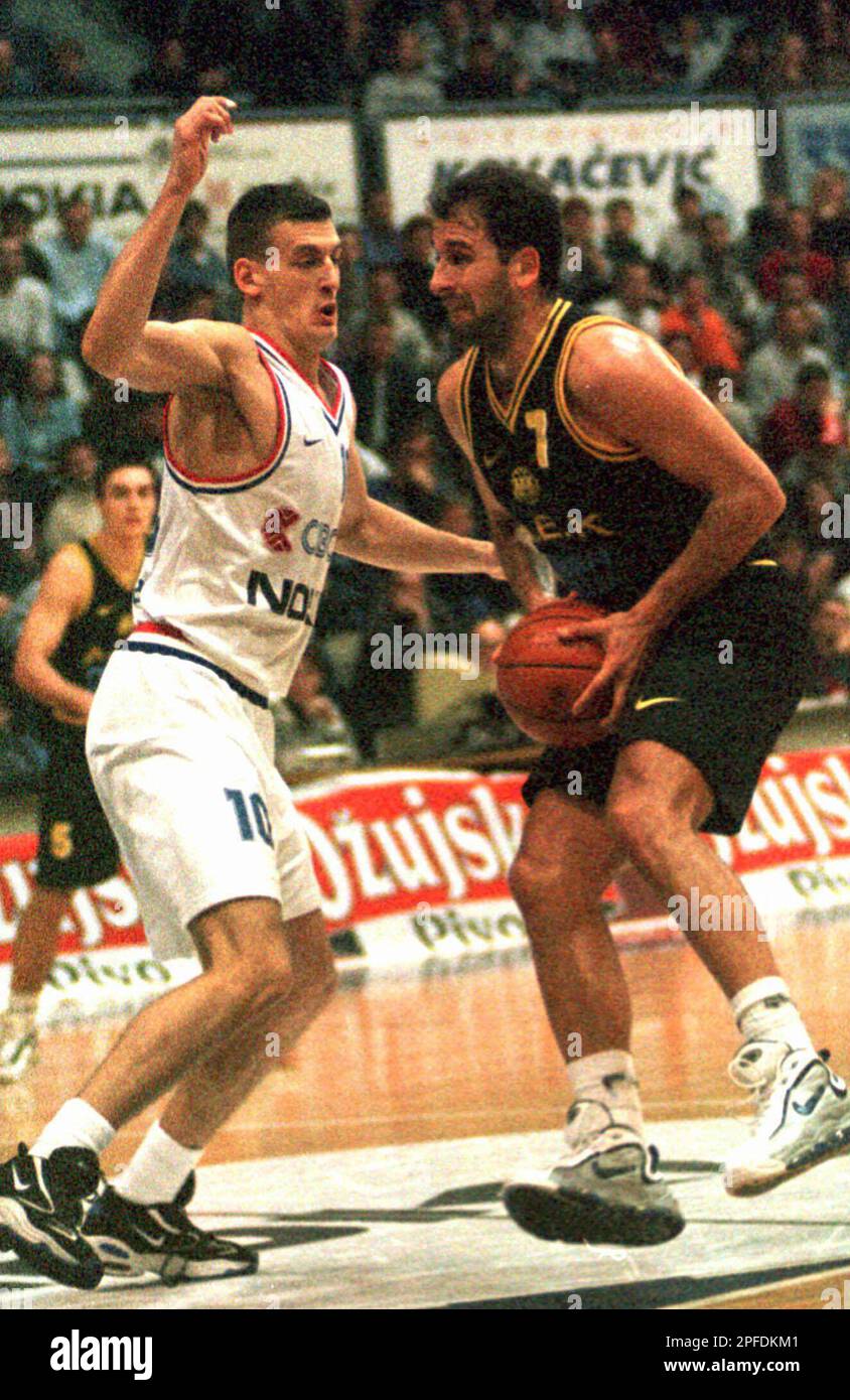 Branislav Prelevic, right, of AEK fights for the ball with Gordan